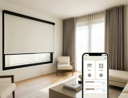 Motorized roller shade and smart curtain in a modern living room with a smartphone control app visible